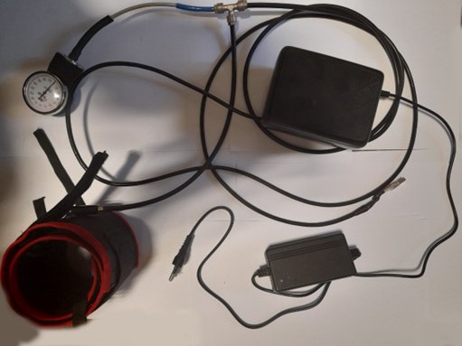 Early prototype with cuff, pressure gauge, controller box and power supply